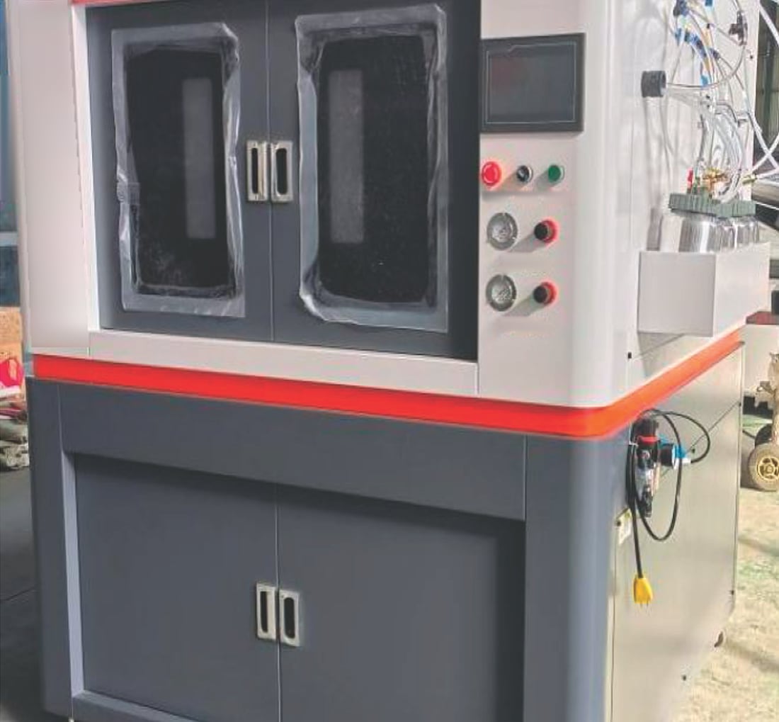 Ascent A-PT-800 automatic spray paint machine with its viewing windows, touch screen and paint cans