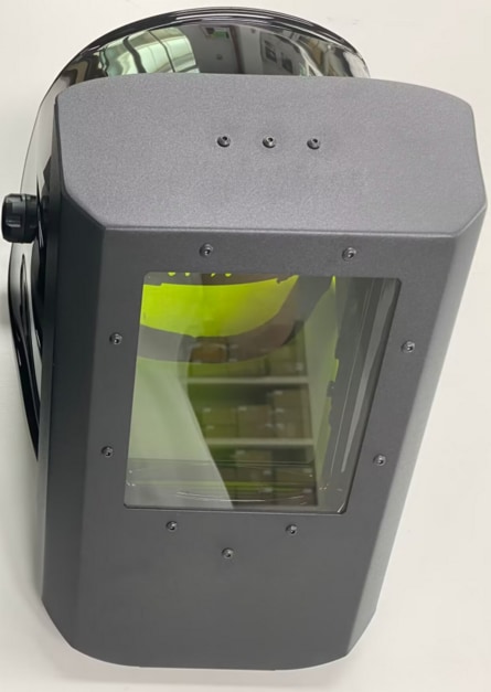 Black laser helmet with a yellow-green filtered viewing window