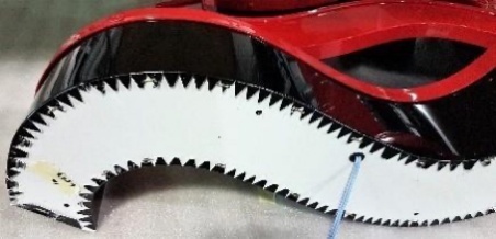Close-up of a red channel letter return showing the notched edge detail produced by the Ascent EDGE-3