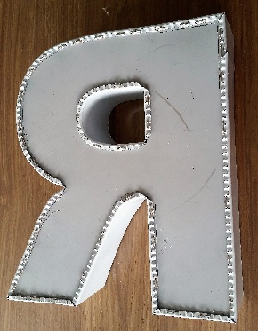 Channel letter R showing stapled trim cap edge detail produced with the Ascent TMB3