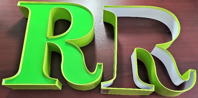 Completed trim cap channel letters R in bright yellow-green produced with the Ascent TMB3