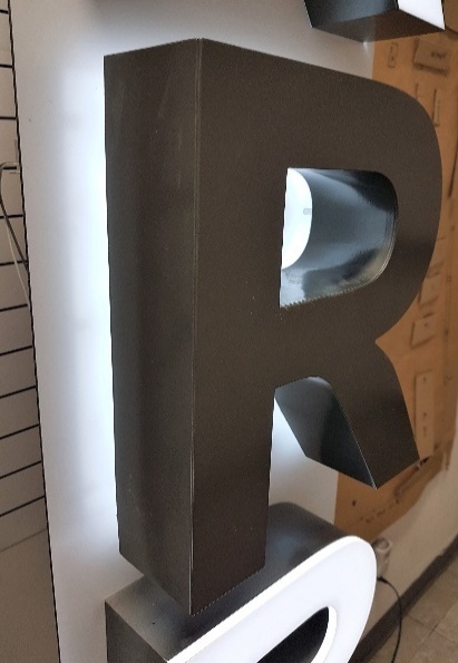 Reverse/halo illuminated channel letter R welded with fiber laser